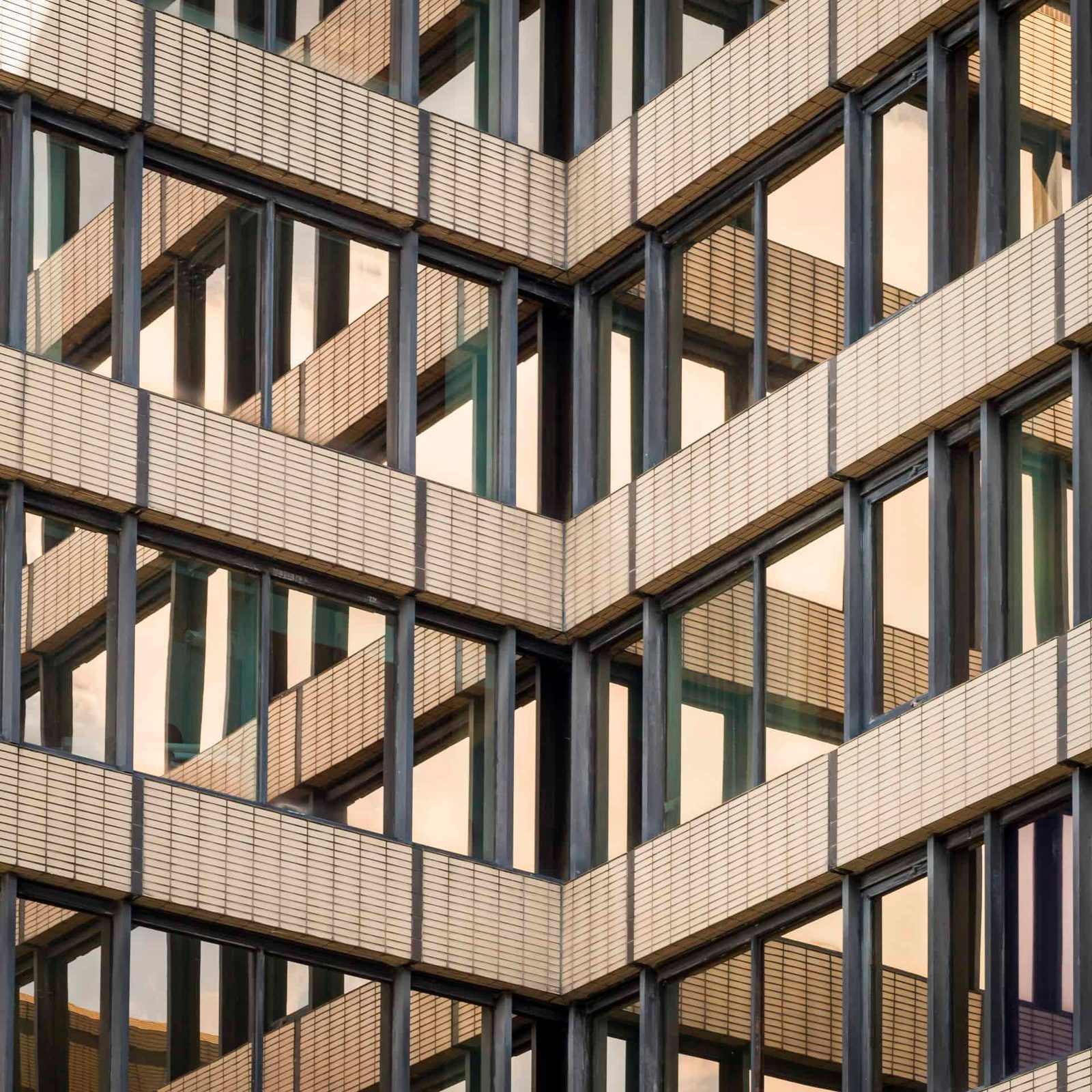 A close up of a building with many windows.