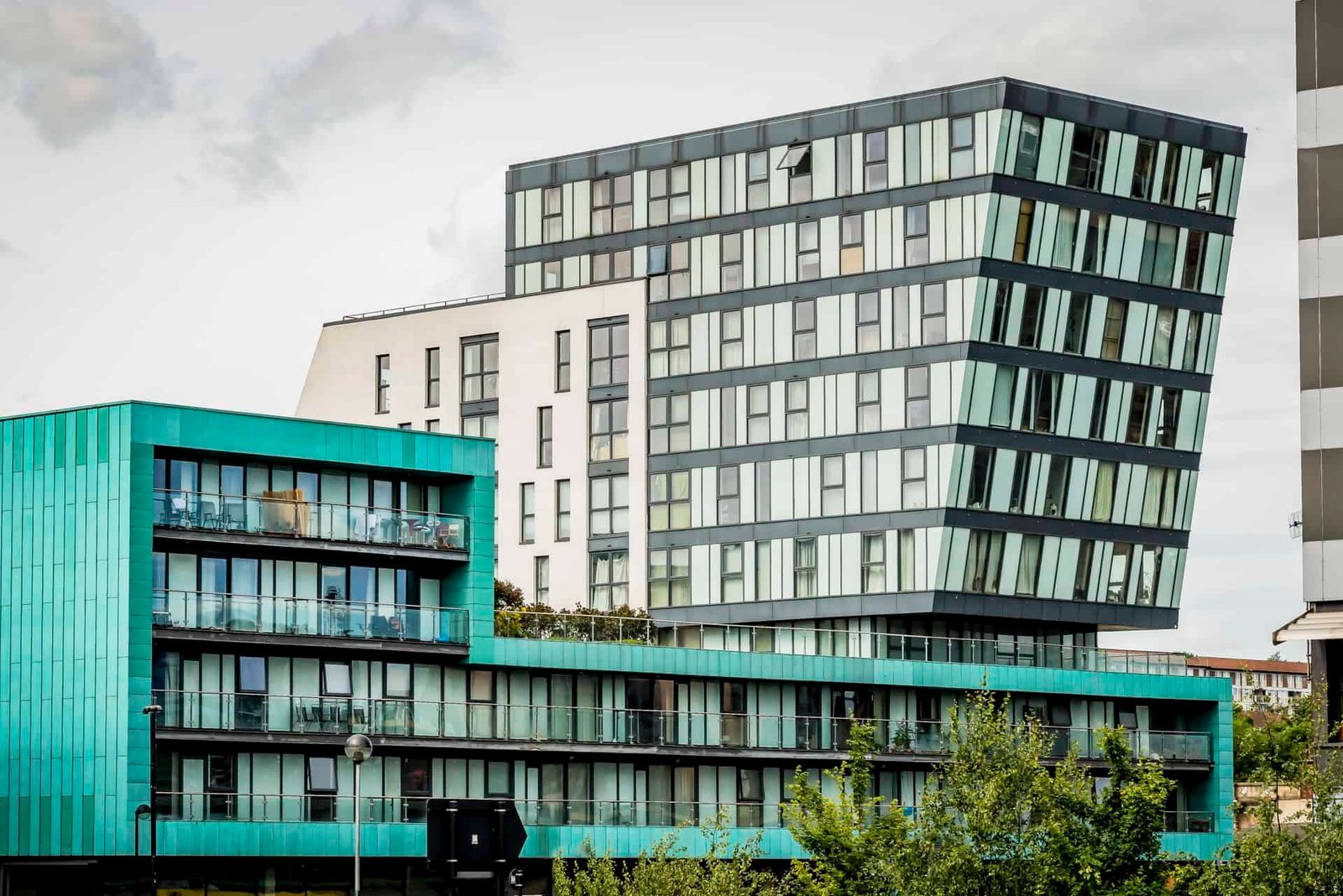 A building with a green and blue facade.
