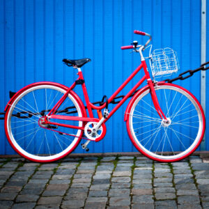 A red bicycle with a basket.