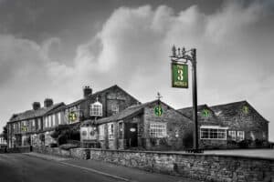 A black and white photo of an old inn.