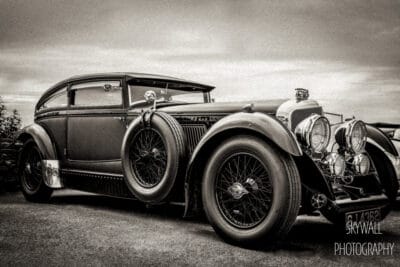 An old black and white photograph of an antique car.
