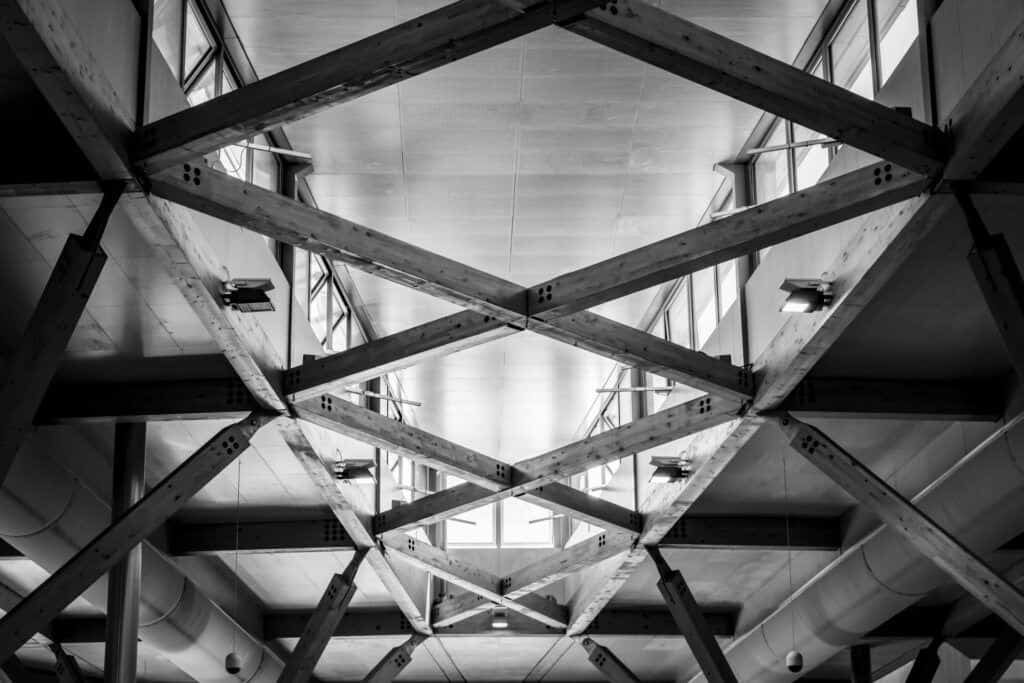 A black and white photo of the ceiling of a building.