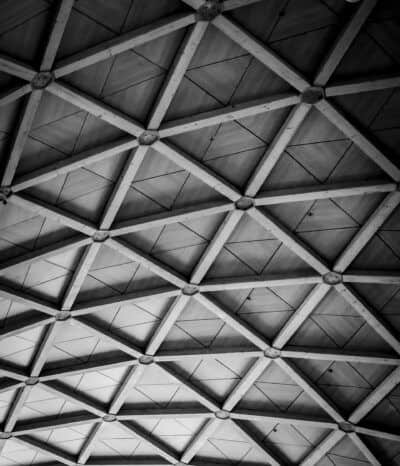 A black and white photo of the ceiling of a building.