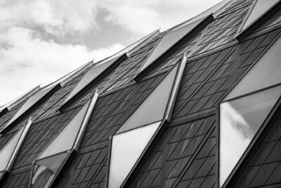 A black and white photo of a modern building.