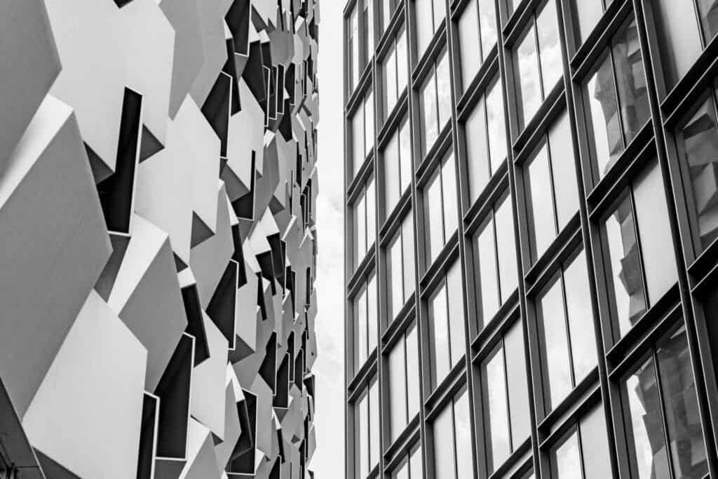 A black and white photo of a building with geometric shapes.