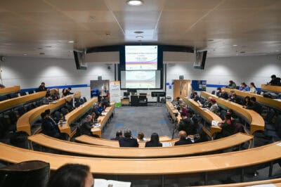 A large lecture hall with many people in it.