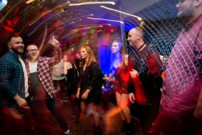 A group of people dancing at a nightclub.