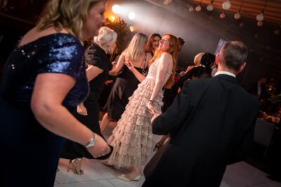 A group of people dancing on a dance floor.