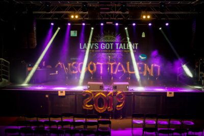 A stage with lights and a sign that says laws of talent.