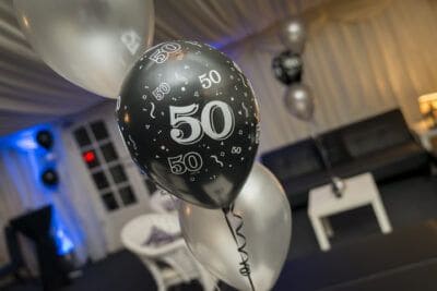 A 50th birthday party with balloons and decorations.