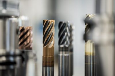 A line of metal cutting tools in a factory.