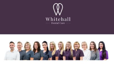 Whitehall dental care logo.