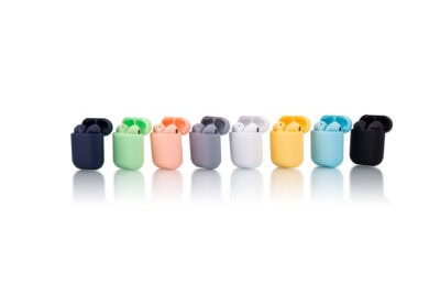 A row of different colored airpods on a white surface.
