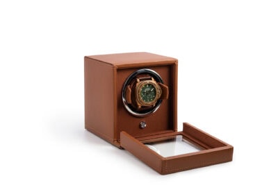A watch winder with a brown leather case.